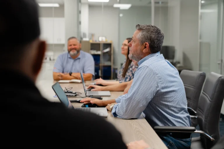 Employees in a meeting inside MAREK offices.