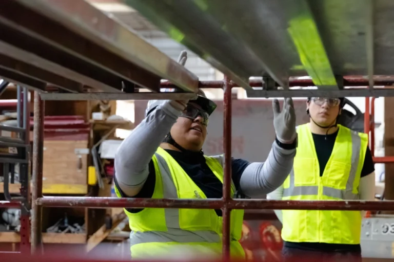 MAREK team working together while in safety gear.